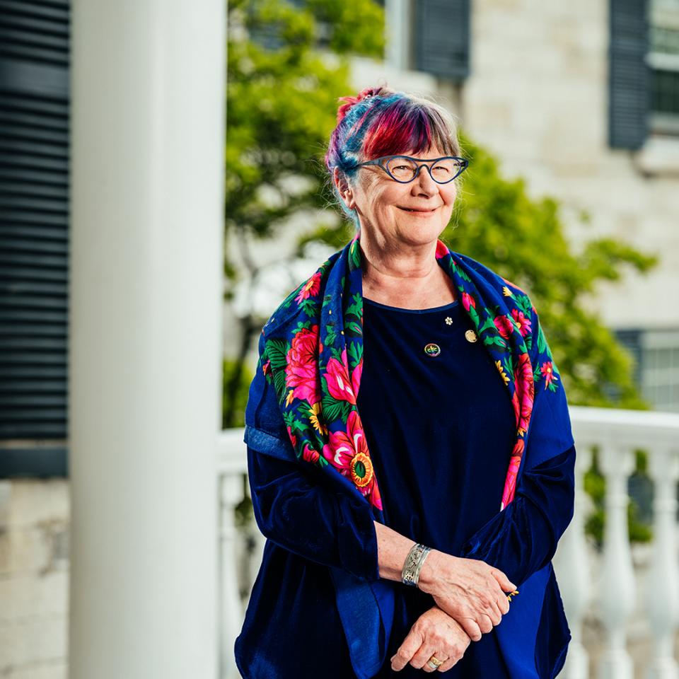Shelagh Rogers, standing on the front porch of Summerhill.