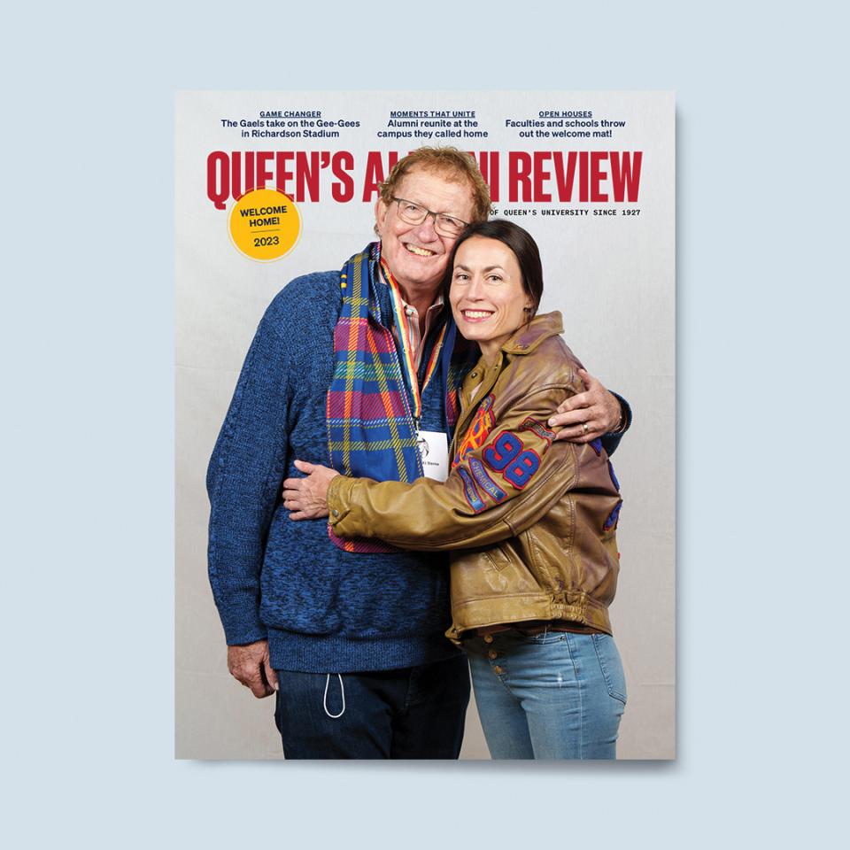 An older man and younger woman embrace, smiling warmly. He wears a scarf and sweater; she wears a vintage leather jacket. Queen’s Alumni Review magazine cover, 2023 edition.