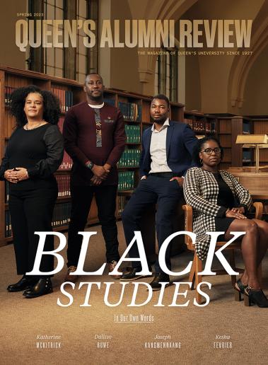 Four faculty of Black Studies pose inside Stauffer Library.