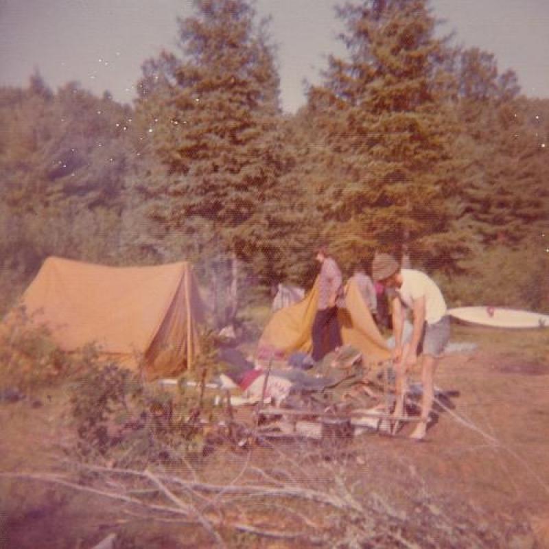 Campers pitch a tent