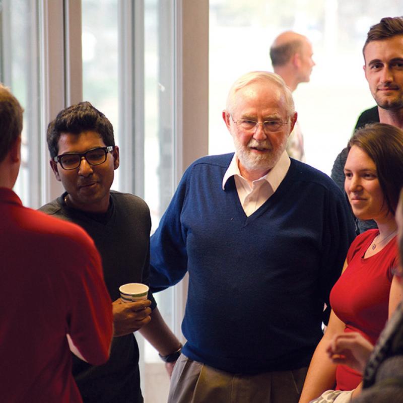 The Department of Physics, Engineering Physics and Astronomy held a celebration for Dr. McDonald. Here, he chats with students in Stirling Hall