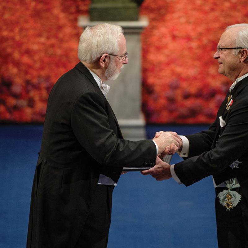 Dr. McDonald formally shaking hands with King Carl XVI Gustaf of Sweden in a ceremony at the Stockholm Concert Hall