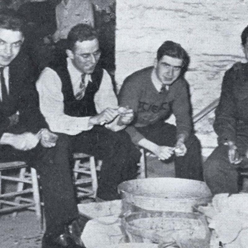 Alfred Bader peeling potatoes with class members  