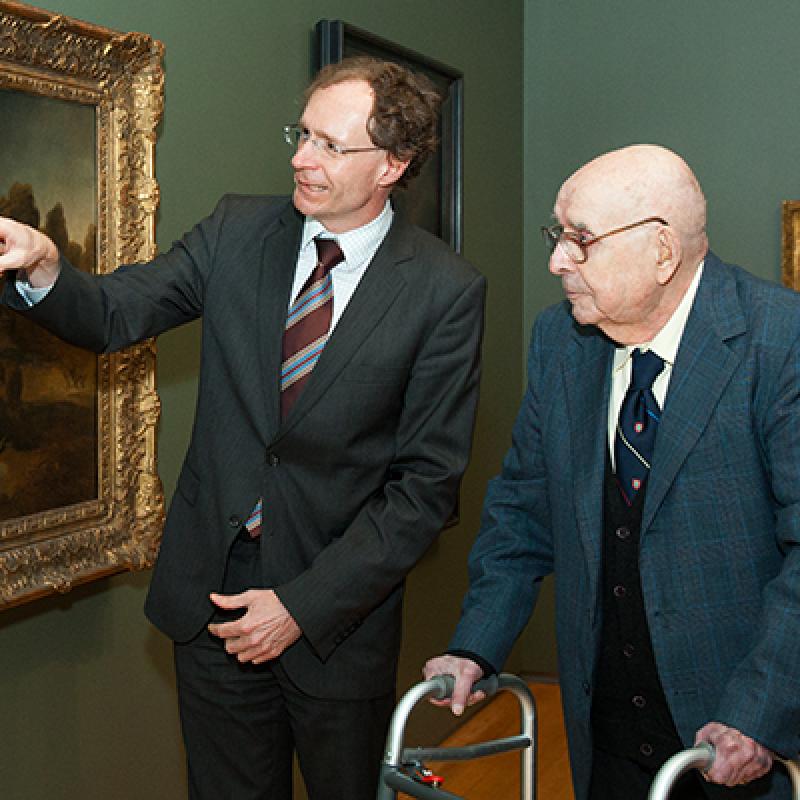David de Witt and Alfred Bader taking a look at one of the paintings at the Agnes Etherington Art Centre