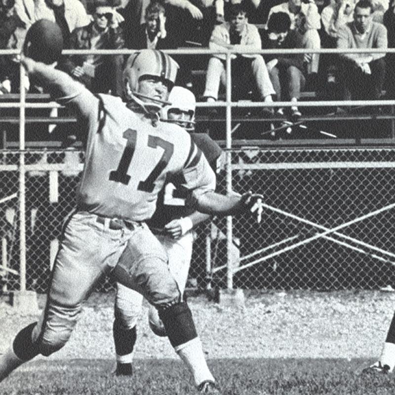 Football players on the field: Cal Connor (No. 17) and Bayne Norrie (No. 25) of the 1964 Golden Gaels.
