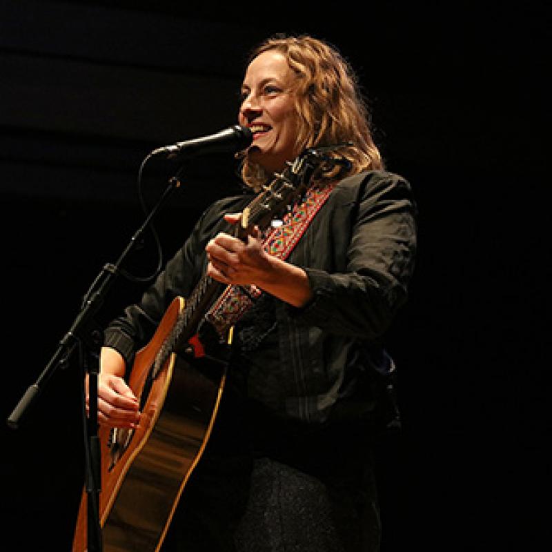 Sarah Harmer singing and playing guitar