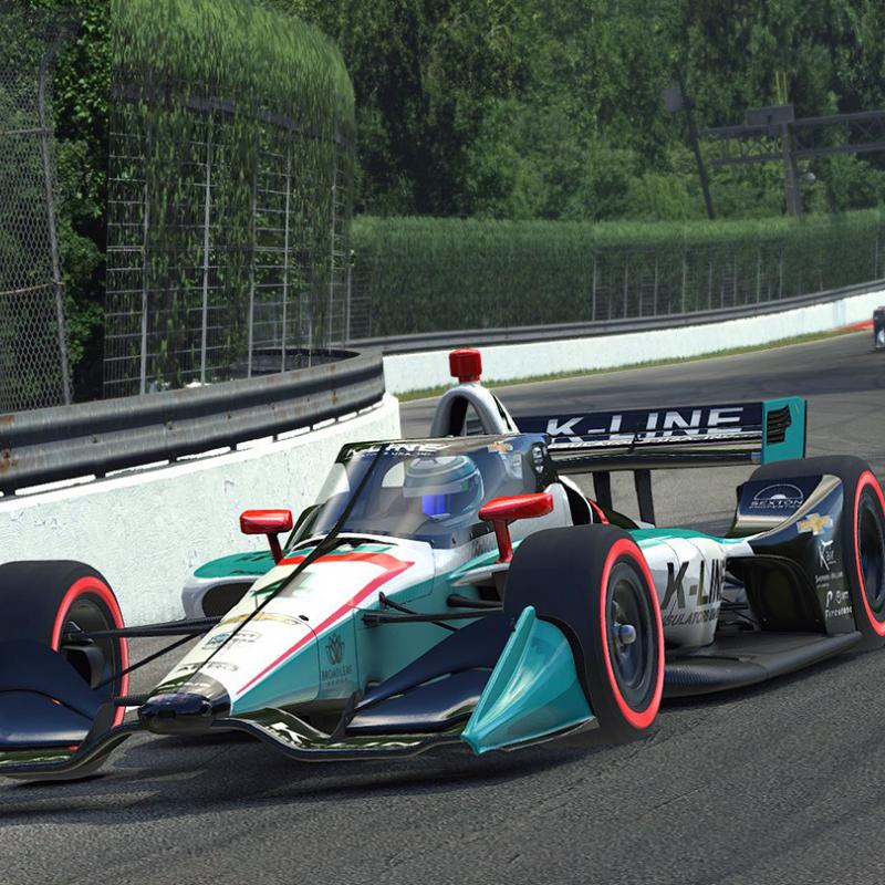 Race car rounding corner on track