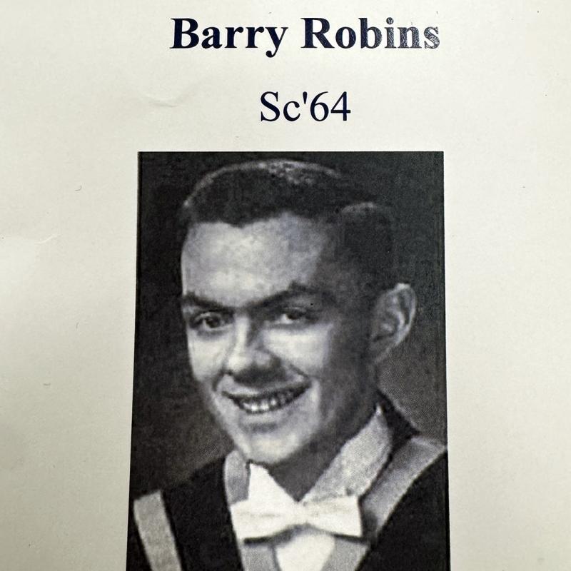 Black-and-white graduation portrait labeled “Barry Robins Sc’64.”