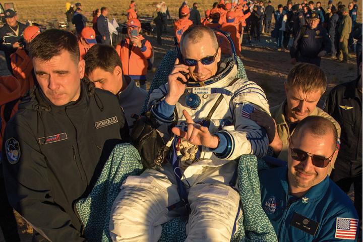 Drew Feustel is carried to a medical tent shortly after he and his crew landed in their Soyuz MS-08 spacecraft near the town of Dzhezkazgan, Kazakhstan