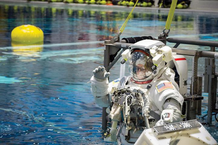 Astronaut Drew Feustel is lowered into the pool at NASA's Neutral Buoyancy Lab.