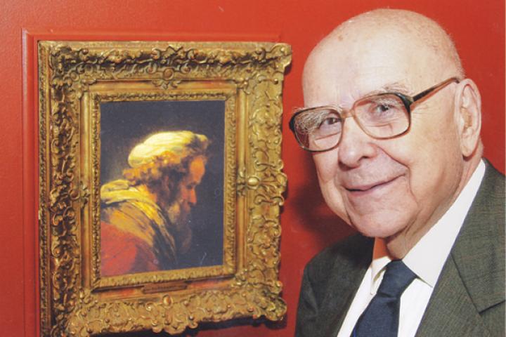 Alfred Bader next to a Rembrandt painting