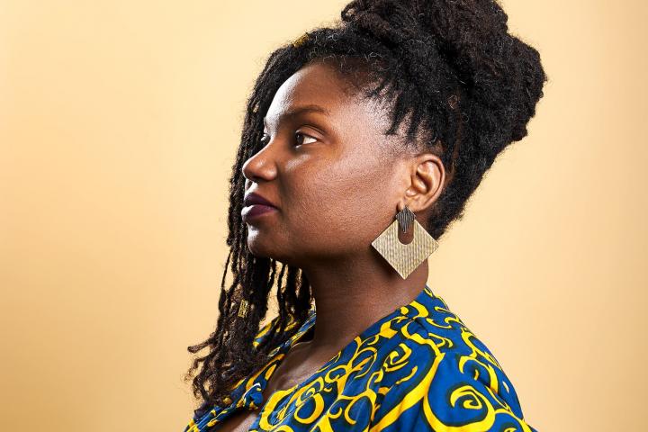 portrait of Grace Adeniyi-Ogunyankin against a yellow background