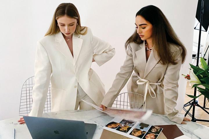 Adrien Bettio and Hyla Nayeri working on new designs in their office.