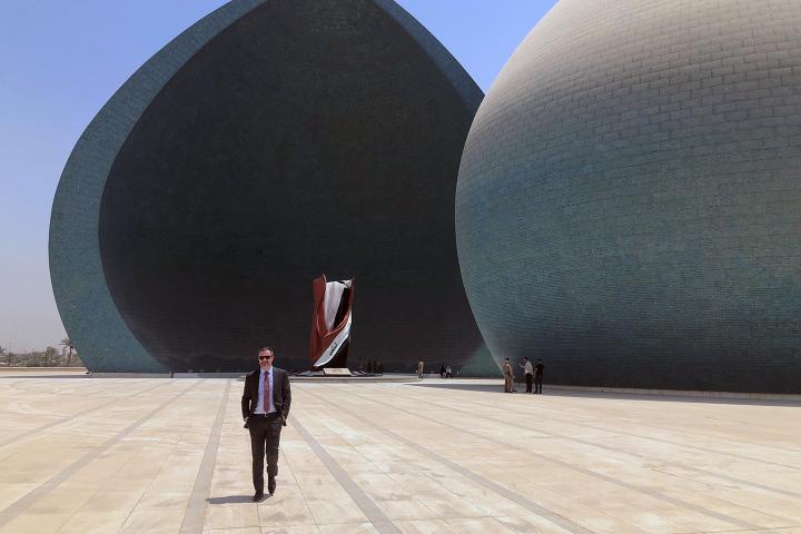 Greg Galligan standing in front of the Al-Shaheed Monument in Baghdad.