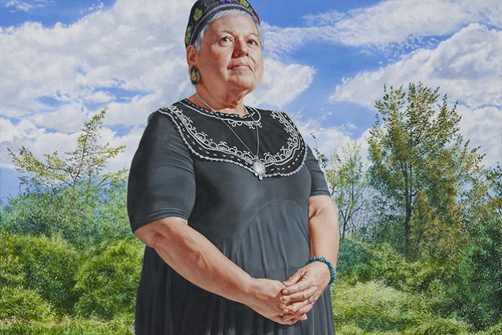 Painted full-body portrait of an older woman standing outdoors in a grassy landscape under a bright blue sky with clouds, wearing a black dress with decorative trim and a patterned headscarf.