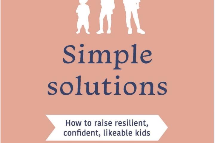 Book cover for Complex Kids, Simple Solutions, featuring silhouettes of three children against a peach and navy background.