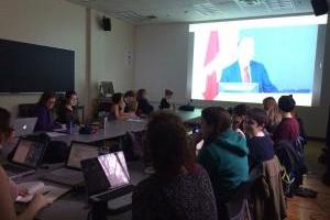 People sitting at tables using computers