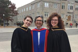 Three people smiling on University Avenue