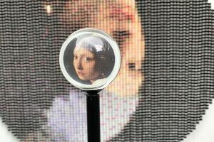 A magnifying glass over a piece of art