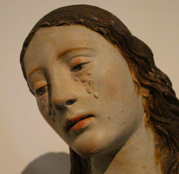 A statute of a person crying