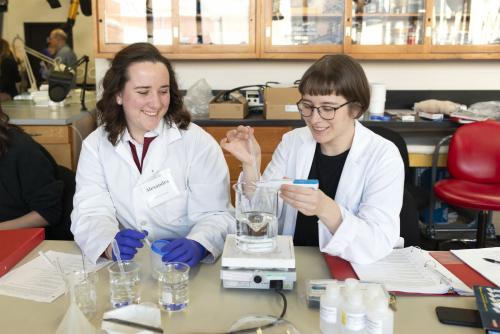 Two people using equipment in a lab