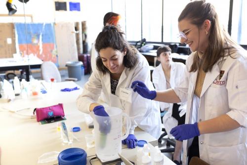 Four people working in a lab