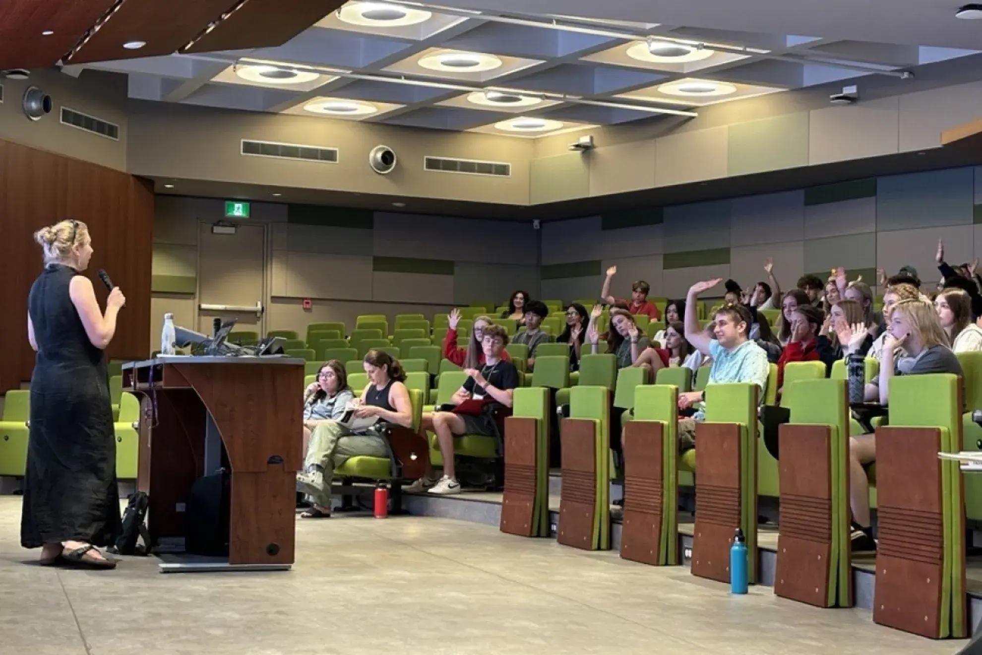 Incoming students ask questions during an information period in a lecture hall as part of Summer Orientation to Academics and Resources (SOAR).