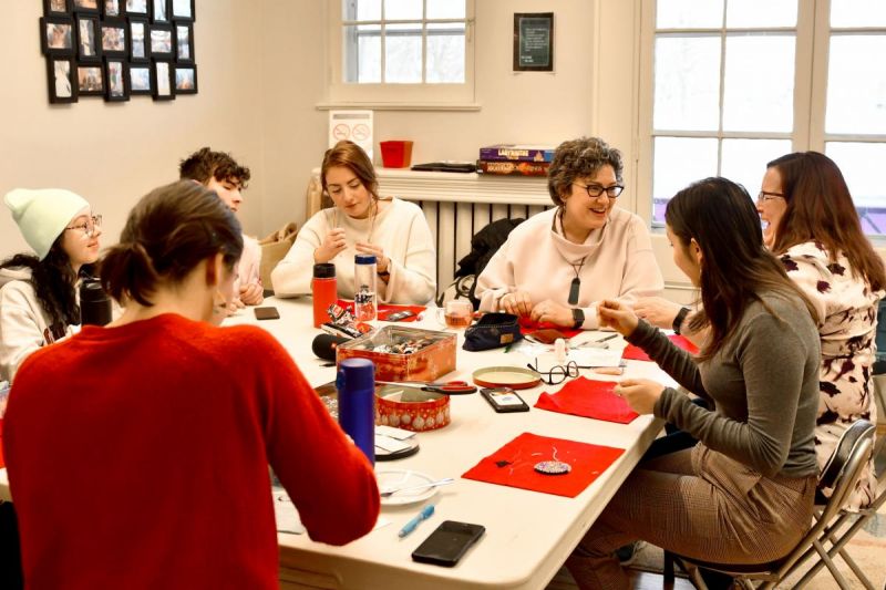 Karen Lawford (third from right) leading a weekly beadwork class at Queen's University's Four Directions Indigenous Student Centre.