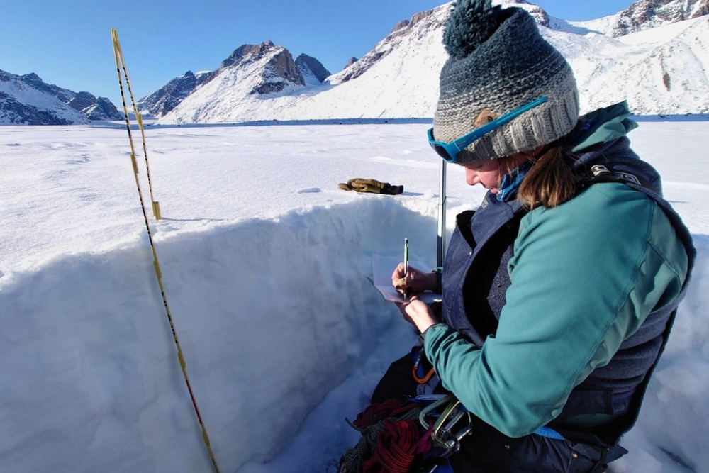 Dr. Thomson conducting snow pit analysis on Turner Glacier, Auyuittuq National Park, Baffin Island, April 2022.