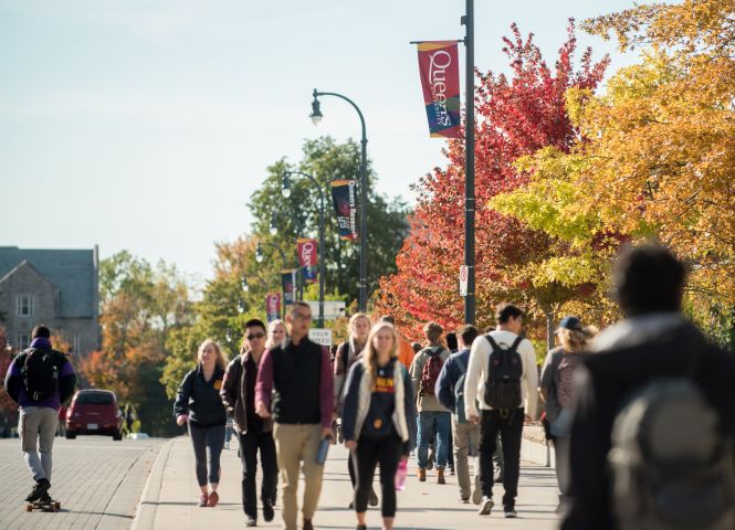 Students walking on Queen's campus in the Fall