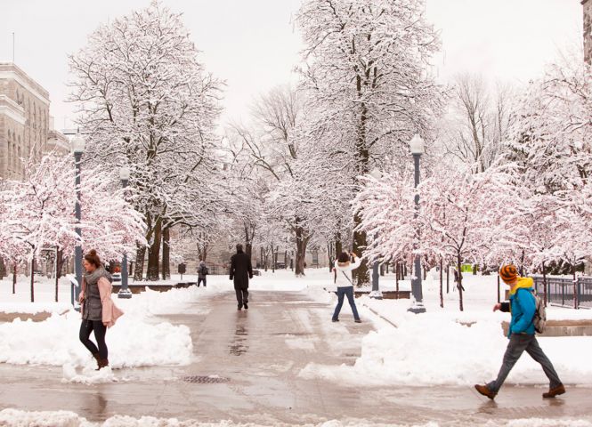 Students walking on Queen's campus in winter