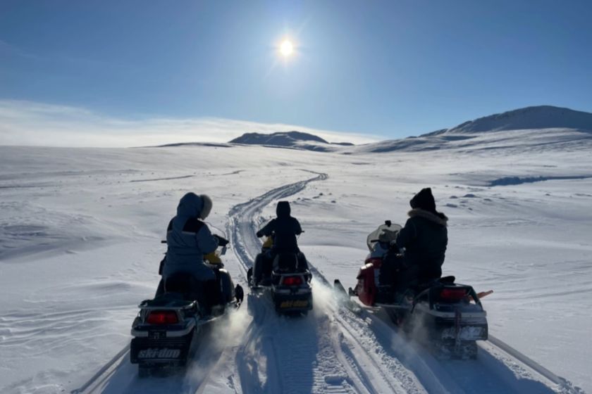 The 2023 ICELab field team heads back to camp on Axel Heiberg Island, NU. From left to right, Sofia Guest (MSc student), Madeline Myers (PhD student), and Miles Ecclestone (Trent University).