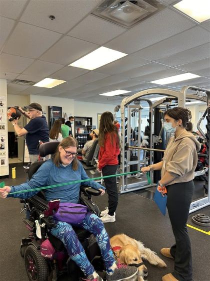 Student works with an exercise band.