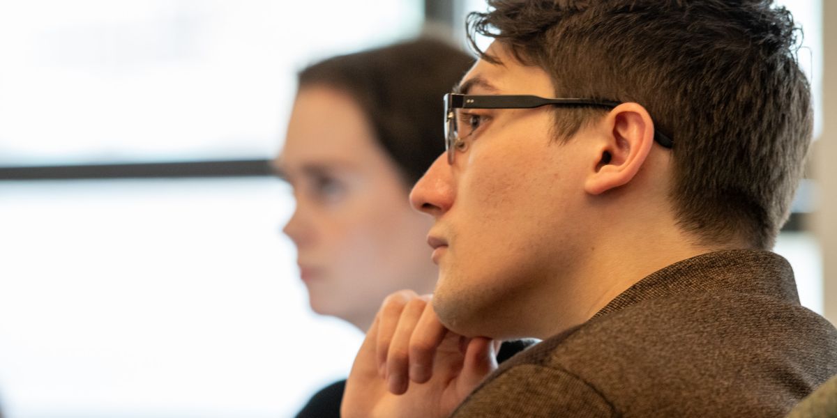 Student looking on in a class.