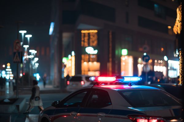 Police car with lights on at night