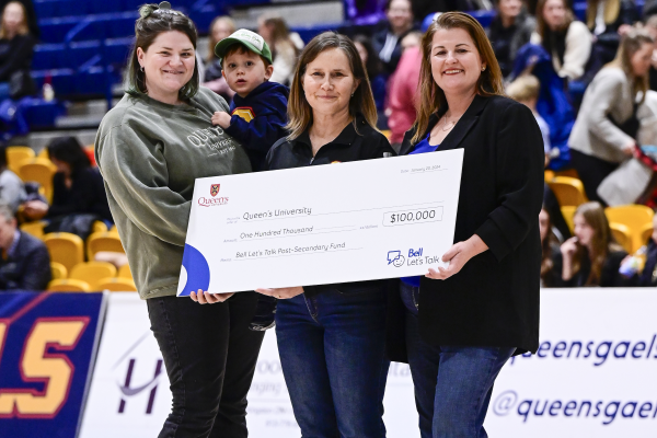 Bell Canada's Paula White (right) presents a Bell Let's Talk grant to Cynthia Gibney (centre), Executive Director of Queen's Student Wellness Services (SWS), and Shannon Bovey (left), Clinical Manager, SWS. (James Paddle-Grant)