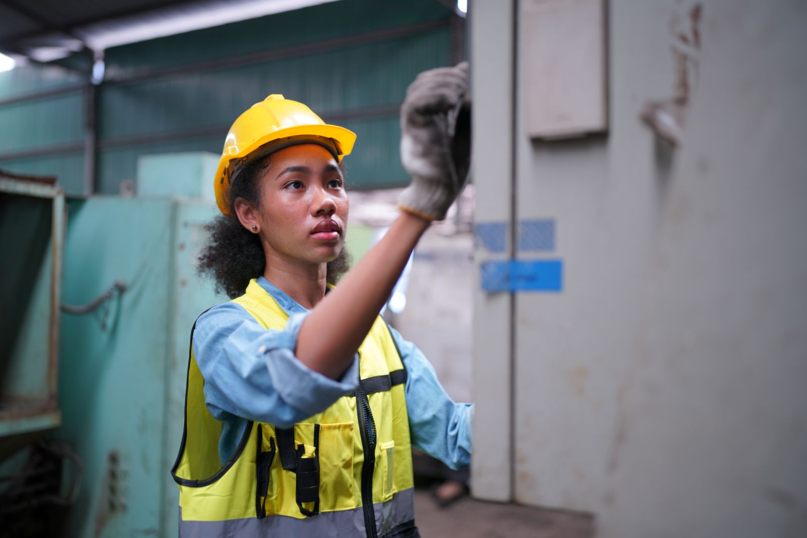 Factory Female Industrial Engineer Works in metal working factory