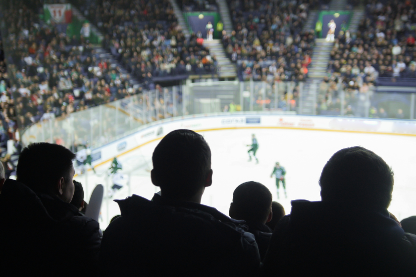 Hockey fans in a hockey rink.