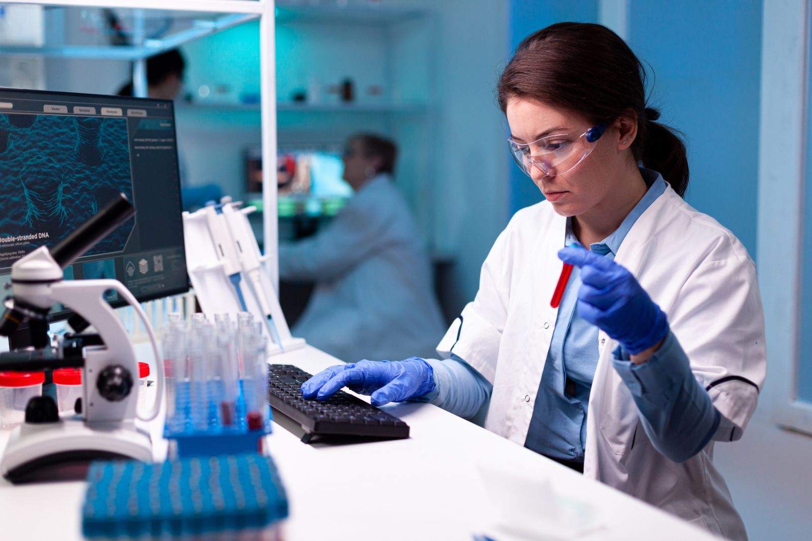 Woman working in a lab with a test tube