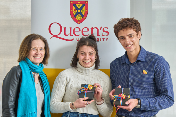 Vice-Provost and Dean of Student Affairs Ann Tierney with Ayden Harrison and Aidan Sander, who were accepting a Peer Leadership Award for the Queen's local committee of World University Service Canada (WUSC).