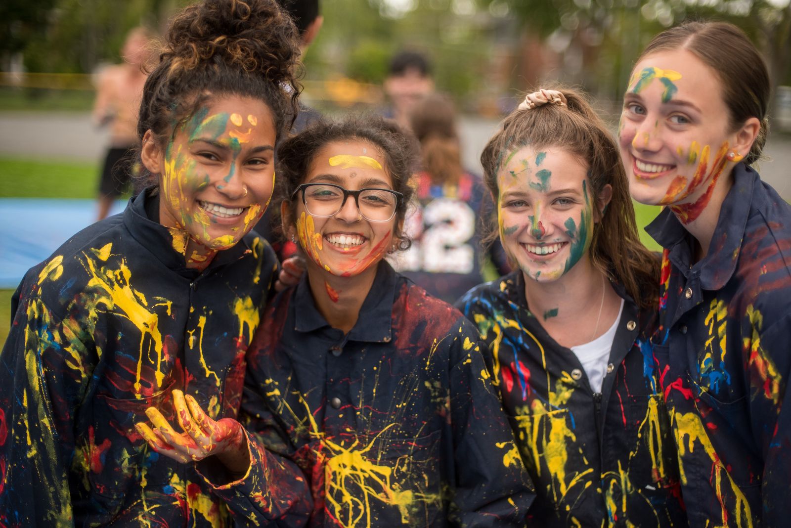Queen's students during Frosh Week with painted coveralls