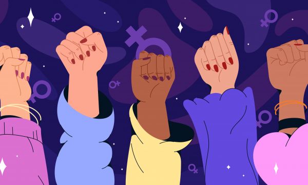 Female hands up on the air with the female gender sign behind them