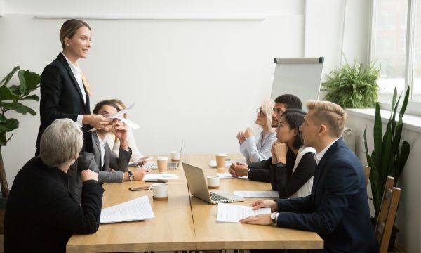 Business professionals having a discussion at a table