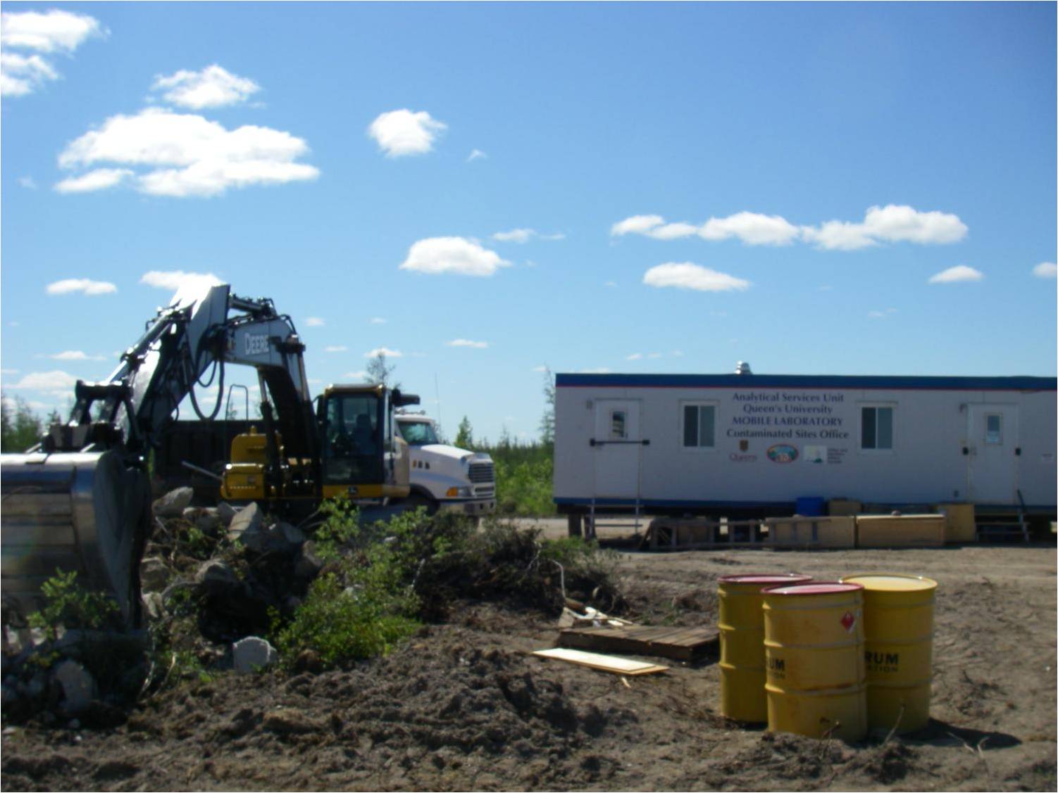 Demolition of concrete pad near mobile lab