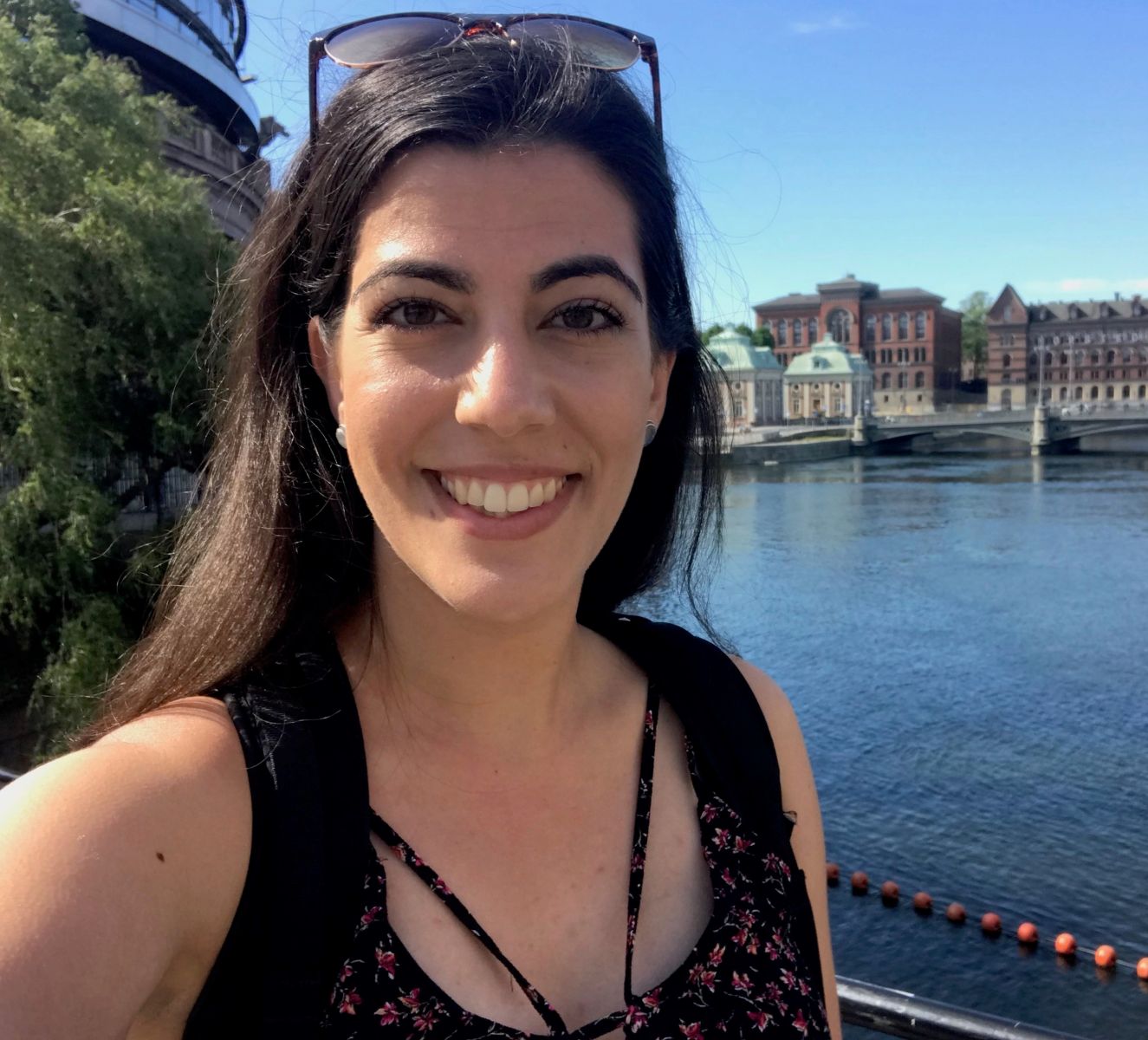 Image of Elizabeth Nelson, MA student, smiling in front of a canal.