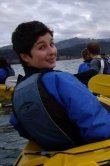 Laura Schaefli kayaking on a lake. 