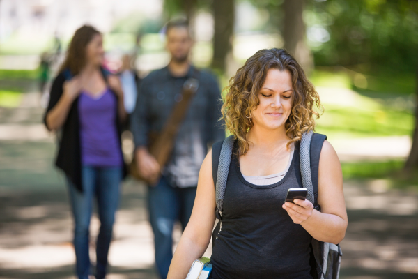 a woman walking with a phone