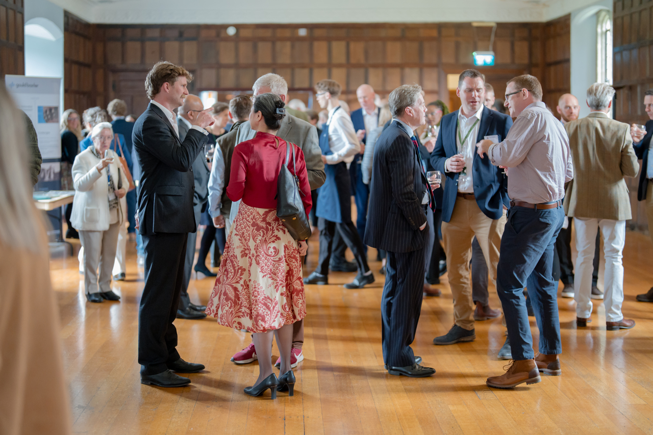 people attending a community event inside the castle