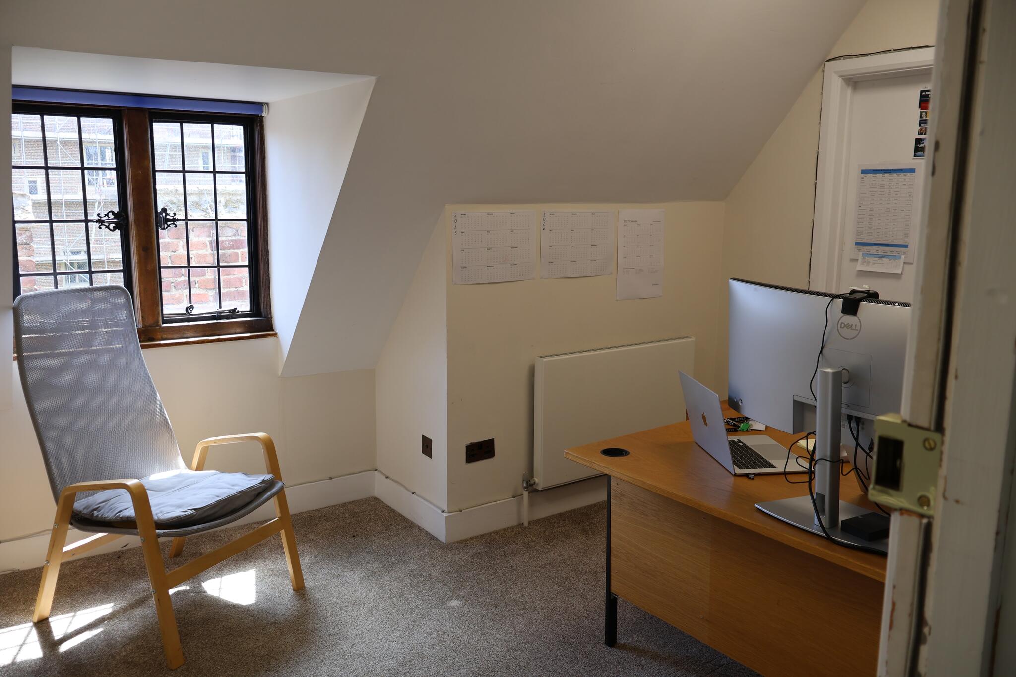 inside a castle office, with chair and window