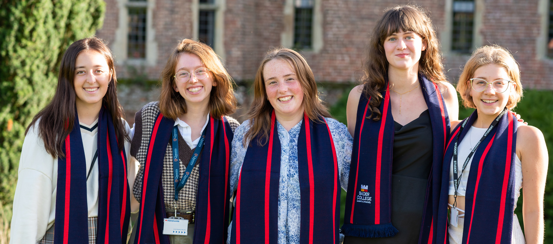 Students pose with their Bader College scarves